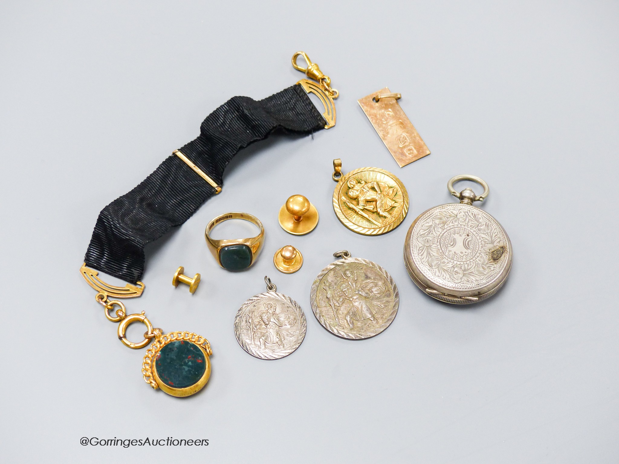 A 1960's 9ct gold and bloodstone set signet ring, size O, a Victorian 9ct gold and chalcedony set swivelling fob seal on a 9ct mounted black sash suspension, a 9ct ingot pendant, (9ct gross 21.3 grams), two 18ct dress st